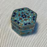 A Small silver 925 and enamel Hexagonal shaped pill box. Designed in an Indian manner. Measures 2.