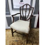 A Georgian parlour arm chair, designed with a shield backing, Recently re- upholstered.