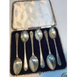 A Set of 6 Sheffield silver golfing spoons. Produced by Walker & Hall. Comes with original box.