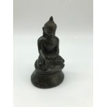 A 16th/17th century bronze figure of a Chinese Buddha, Measures 10.5cm in height