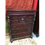 A reproduction darkwood large chest of drawers, Set with a single hidden top drawer. Fitted with