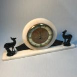 Art Deco marble and granite mantel clock designed with cold painted bronze doe's to each end (