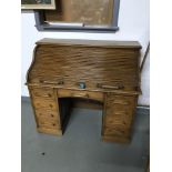 Antique light oak roll top knee hole desk. Comes with key.