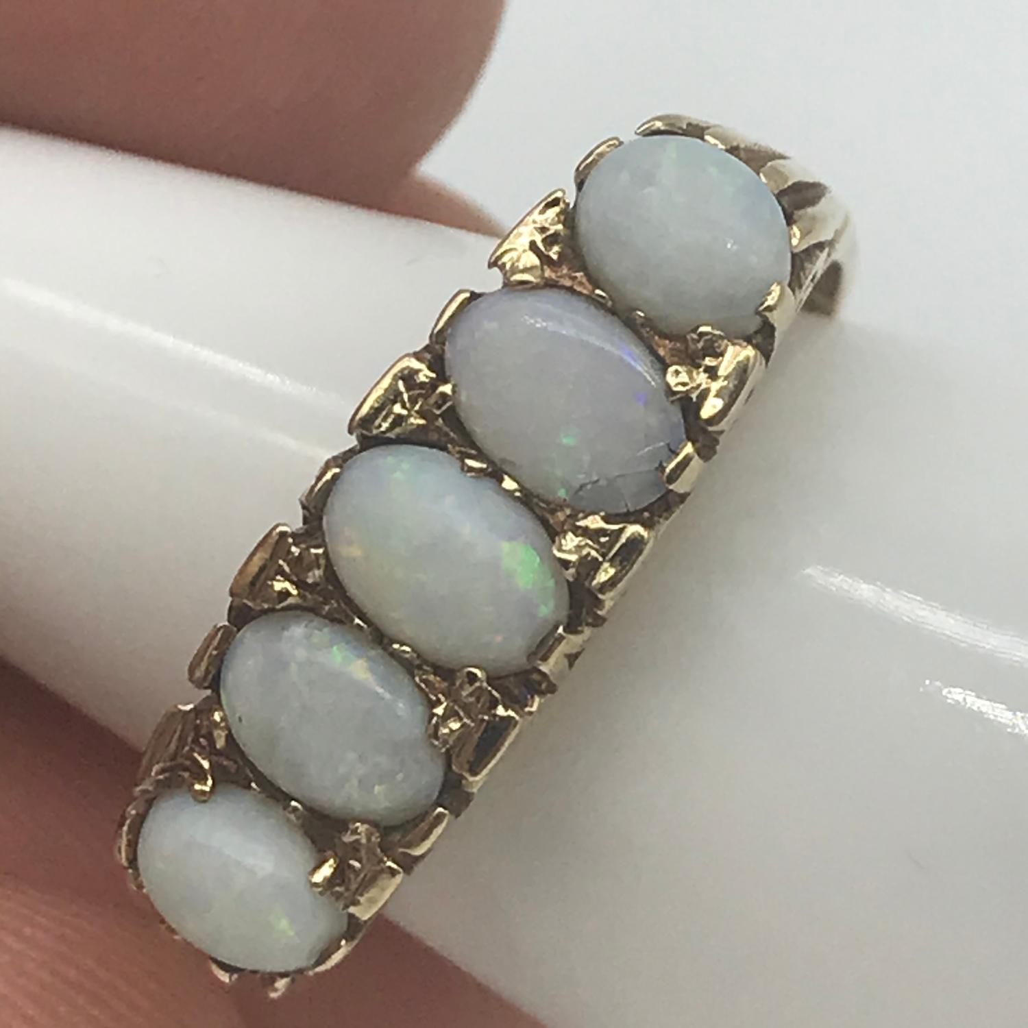 A 9ct gold ladies large set opal set ring, Consists of 5 large opal stones, Ring size Q, Weighs 3. - Image 3 of 3