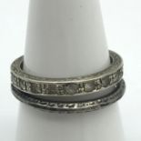 A Ladies 9ct gold band ring set with clear stones together with a Sterling Silver band ring. 9ct