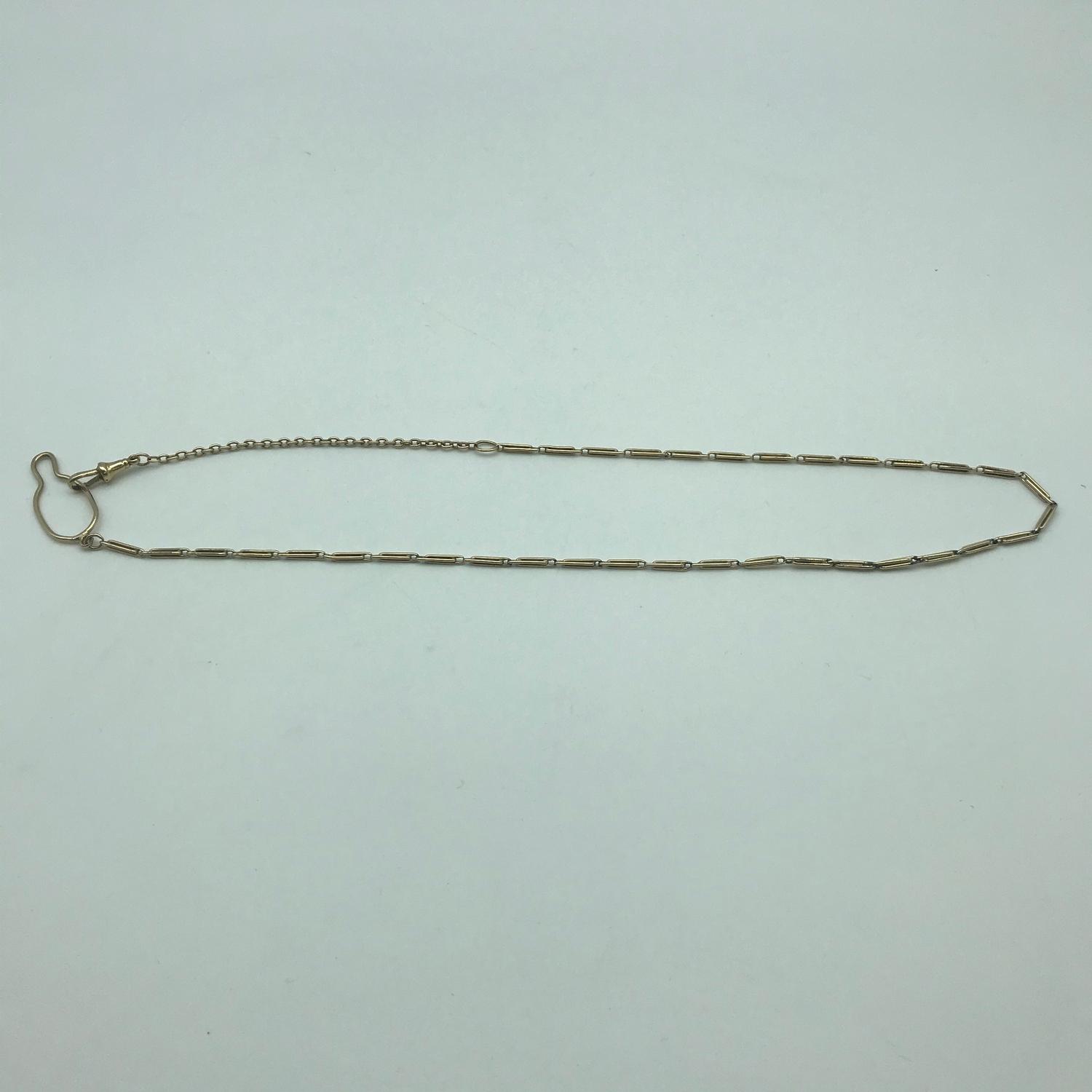 A 9ct gold Necklace possibly an Albert Chain. Measures 22inches. Weighs 12.77grams