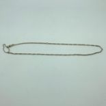 A 9ct gold Necklace possibly an Albert Chain. Measures 22inches. Weighs 12.77grams