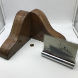 A Pair of solid wood Art Deco book ends together with an Art Deco chrome and glass picture frame.