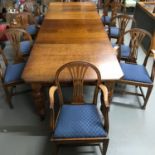 A Large solid oak Victorian board room wind- out table with 10 Victorian matching wheel back