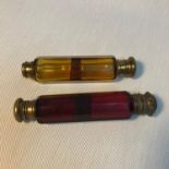 A Lot of two Victorian double end perfume bottles, One designed in amber glass and the other in a