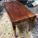 A Victorian pembroke table with drop end sides, Large single under drawer, Turned leg supports and