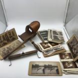 Antique hand held slide scope with various antique and vintage slides.