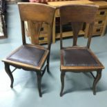 A Pair of late Victorian Parlour chairs designed with Cabriole leg supports. Studded and brown
