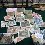 A Collection of antique and vintage world bank notes and coins.