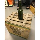 A vintage Robinson's advertising crate together with 12 'G.Thomson & Son' green bottles