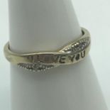 A Ladies 9ct gold and diamond "I LOVE YOU" Ring. Ring size M. Weighs 1.24grams