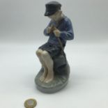 Royal Copenhagen Denmark boy figurine. Measures 18.5cm in height