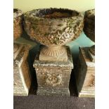 A Garden pedestal planter urn. Two Pieces. Detailed with leaf and flower design