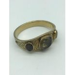 An 18ct gold plated Victorian bangle set with three large stones.