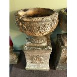 A Garden pedestal planter urn. Two Pieces. Detailed with leaf and flower design