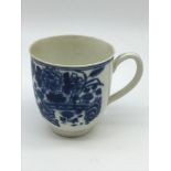 An early 18th century Worcester blue crescent moon marked floral design blue and white tea cup. Dr