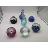 A collection of five Caithness paperweights together with one other paperweight & a perfume