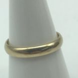 A 9ct gold wedding band. Ring size M. Weighs 2.27grams