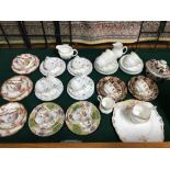 A Lot of vintage part tea sets which includes Hammersley trios designed in the Dresden sprays, Royal