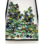 A Collection of vintage glass, metal and porcelain marbles.