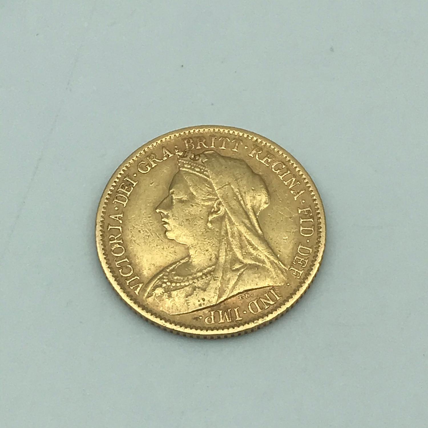 1899 gold half sovereign showing old Queen Victoria head.