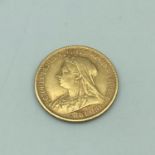 1899 gold half sovereign showing old Queen Victoria head.