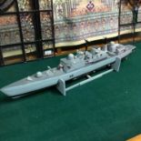 A Vintage model of a destroyer "York" made from balsa wood. Has workings to the inside. Measures