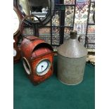 A Vintage railway lamp fitted with a modern clock working together with a vintage oil can