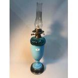 A Victorian two section blue glass paraffin lamp, Measures 71cm in height