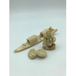 A Japanese meiji period Ivory carved netsuke of a man riding an ox. Signed t the base. Together with