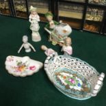 A Collection of porcelain wares which includes German Bisque figures, Pin Cushion ladies, Roselle