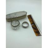 A Lot of silver hall marked items, Includes Brush, comb, napkin ring and condiment pot.