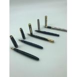 A Lot of 5 vintage fountain pens which includes two Parker pens which have 14ct gold nibs.