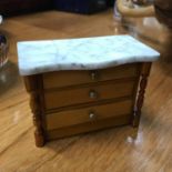 A Vintage apprentice chest of drawers with marble top. Measures 7x10x5cm