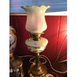 A Victorian Falk Stadelmann & Co Paraffin brass and glass lamp. Hand painted flower design, finished
