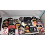 A Collection of 45 singles to include ACDC, Iron Maiden, Motorhead, Twisted Sister, Thin Lizzy and