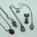 A Lot of 4 large silver pendants set with hard stones and precious stone inserts (Three pendants