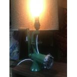 A Vintage enamelled mincer converted into a table lamp. In a working condition.