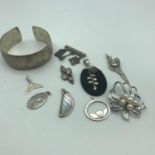 A Lot of silver jewellery which includes 800 grade bangle, Silver & pearl brooch, Silver leaf and