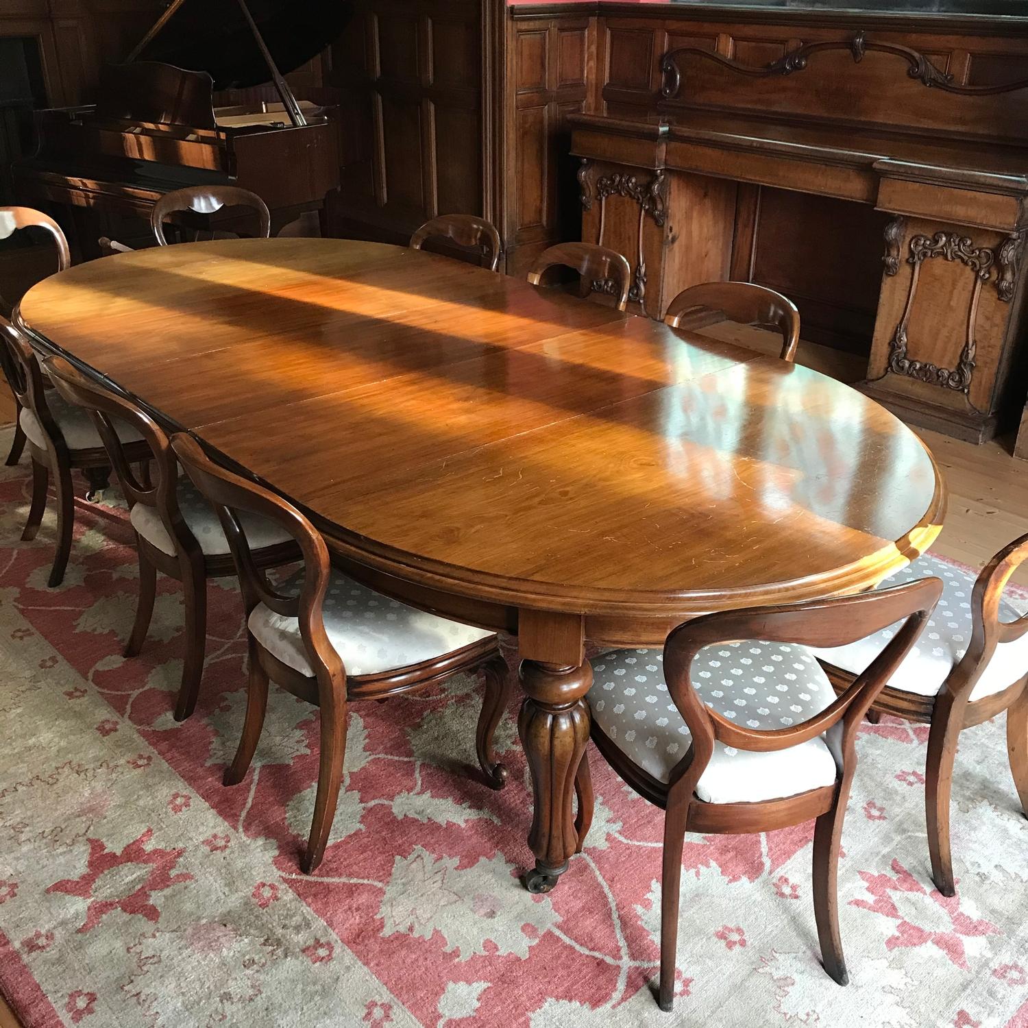 A Large Victorian boardroom table in Mahogany, comes with three leafs and 10 Victorian balloon