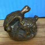 A Japanese hand carved netsuke Family of Turtles hand singed by the artist.