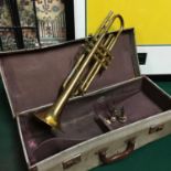 A Vintage Besson & Co Trumpet. Comes with three mouth pieces and travel case