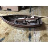 Antique hand made model of a rowing/ sail boat. Measures 9x55x22cm