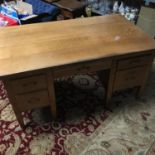 A Solid light wood early 1900's knee hole desk, 5 fitted drawers. Desk measures 77x153x91cm