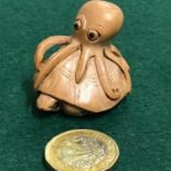 Japanese hand carved netsuke of a Octopus on top of a turtle. Signed by the artist. 3.4cm in height
